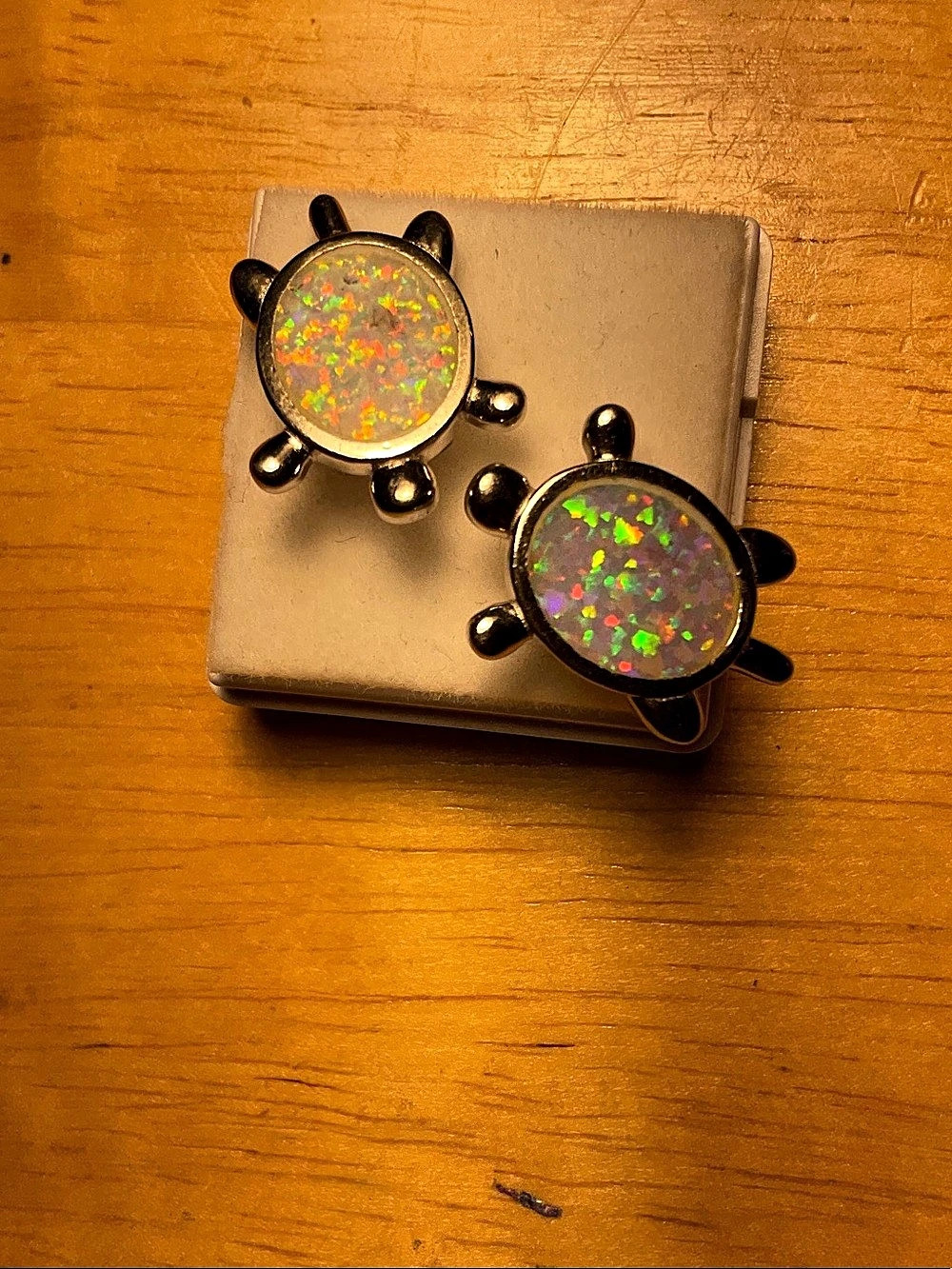 4.23 grams silver and opal turtle shaped earrings.
